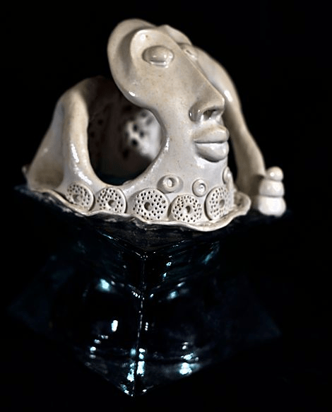 Fantasy face in white  Polymer Clay Sculpture with doted circles for a collar 4.5  x 4.5 x 34.5  B 7   by artist  Hollis Richardson
