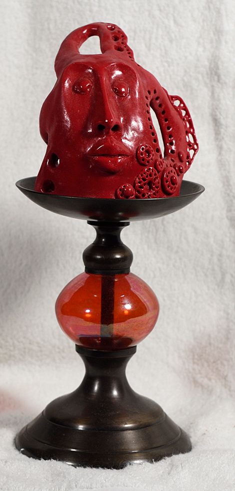 Stylized head, long nose, large lips, lace like adornment in red Polymer Clay Sculpture   10  x 4.5 x 4  by artist Hollis  Richardson