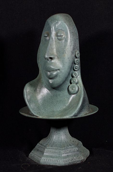 Interesting head of  man. Polymer Clay Sculpture in gray green with long earring  7.5 x 4 x 4.5 by  artist  Hollis  Richardson