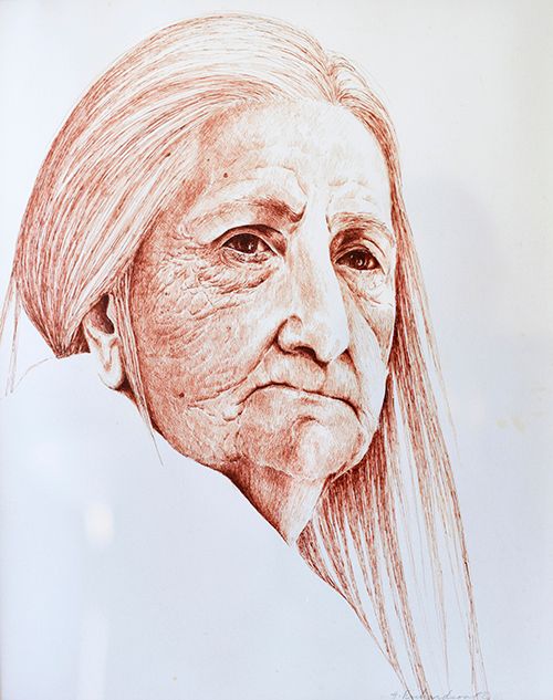 Protrail of older woman with long strainght hair and weatjhered face. A mapsterpiece in pen and brown ink by artist, Hollis Richardson.